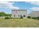 Scenic backyard with verdant grass and a practical patio area at 4615 Elmwood Trl, Cumming, GA 30028