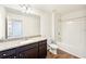 Full bathroom with modern finishes including a granite vanity and shower-tub combo at 4615 Elmwood Trl, Cumming, GA 30028