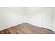 Bedroom featuring two doors, wood-look flooring, and neutral paint at 4615 Elmwood Trl, Cumming, GA 30028