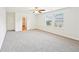 Spacious bedroom boasts plush carpet, two bright windows, and a ceiling fan for added comfort at 4615 Elmwood Trl, Cumming, GA 30028
