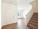 This entryway is well-lit, leads to the stairs, and features hardwood flooring at 4615 Elmwood Trl, Cumming, GA 30028