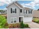 Beautiful home with a two-car garage and lovely landscaping at 4615 Elmwood Trl, Cumming, GA 30028