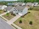 Charming two-story home features a well-manicured lawn and a long, paved driveway to a built-in garage at 4615 Elmwood Trl, Cumming, GA 30028