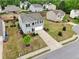 Charming two-story home features a well-manicured lawn and a long, paved driveway to a built-in garage at 4615 Elmwood Trl, Cumming, GA 30028
