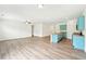 Open-concept living room and kitchen features hardwood flooring and plenty of natural light at 4615 Elmwood Trl, Cumming, GA 30028