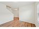 The living room is a bright space featuring beautiful wood-look flooring and neutral walls at 4615 Elmwood Trl, Cumming, GA 30028