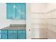 This kitchen features a large pantry with metal shelving and plenty of room for storage at 4615 Elmwood Trl, Cumming, GA 30028