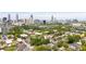 Scenic aerial view of Atlanta featuring an expansive cityscape with lush green trees at 94 Hogue Ne St, Atlanta, GA 30312