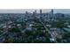 Aerial view of neighborhood with city skyline in the background, showing proximity to urban amenities at 94 Hogue Ne St, Atlanta, GA 30312