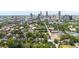 Stunning aerial view of lush neighborhood with downtown skyline in background on a sunny day at 94 Hogue Ne St, Atlanta, GA 30312
