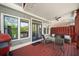 Cozy back porch with outdoor seating, ceiling fan, and view of the fenced backyard at 94 Hogue Ne St, Atlanta, GA 30312