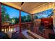 Inviting outdoor deck with a fire pit, seating, barbecue grill and lush greenery at 94 Hogue Ne St, Atlanta, GA 30312