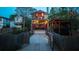 View of the backyard deck, lighting, pergola, garage, and a fenced in yard at 94 Hogue Ne St, Atlanta, GA 30312