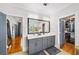A modern bathroom with double sinks, a large mirror, and a walk-in closet at 94 Hogue Ne St, Atlanta, GA 30312