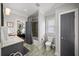 Updated bathroom with modern gray tones featuring a shower-tub combination and stylish fixtures at 94 Hogue Ne St, Atlanta, GA 30312