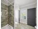 Modern bathroom with tiled shower and glass, contemporary fixtures, and sleek finishes at 94 Hogue Ne St, Atlanta, GA 30312