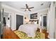 A spacious bedroom with hardwood floors, a ceiling fan, and a neutral color scheme at 94 Hogue Ne St, Atlanta, GA 30312