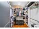 A spacious walk-in closet with custom shelving, hanging rods, and a bench at 94 Hogue Ne St, Atlanta, GA 30312