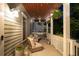 Charming covered porch with comfortable seating, plants, and ceiling fans for relaxing outdoors at 94 Hogue Ne St, Atlanta, GA 30312