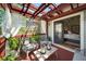A charming deck with a pergola, comfortable seating, and access to a bedroom at 94 Hogue Ne St, Atlanta, GA 30312