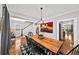 Charming dining room with modern chandelier, hardwood floors, and convenient access to the staircase and living area at 94 Hogue Ne St, Atlanta, GA 30312