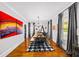 Elegant dining room boasts hardwood floors, stylish decor, and ample natural light from large windows at 94 Hogue Ne St, Atlanta, GA 30312