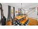 Inviting dining room features a rustic wood table with bench seating, modern lighting, and large windows at 94 Hogue Ne St, Atlanta, GA 30312