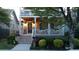 Beautiful two-story home with a welcoming porch, brick stairs, and professional landscaping at 94 Hogue Ne St, Atlanta, GA 30312