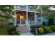 Beautiful two-story home with a covered porch, flower boxes, and professionally landscaped yard at 94 Hogue Ne St, Atlanta, GA 30312