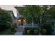 Beautiful two-story home with a covered porch, flower boxes, and professionally landscaped yard at 94 Hogue Ne St, Atlanta, GA 30312