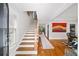 Inviting foyer with hardwood floors, stairs, and views into the home at 94 Hogue Ne St, Atlanta, GA 30312