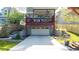 Spacious drive-under garage with room for parking and manicured landscaping at 94 Hogue Ne St, Atlanta, GA 30312