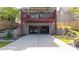 Spacious drive-under garage with two cars parked inside at 94 Hogue Ne St, Atlanta, GA 30312