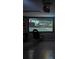 Converted garage features projector and racecar gaming seat set up, offering entertainment space at 94 Hogue Ne St, Atlanta, GA 30312