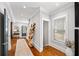 Bright hallway boasts hardwood floors, elegant trim, and a view to the staircase and entry area at 94 Hogue Ne St, Atlanta, GA 30312