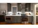 Elegant kitchen with stainless steel appliances, quartz countertop, and under-cabinet lighting at 94 Hogue Ne St, Atlanta, GA 30312