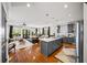 Open-concept kitchen and living area with island, stainless appliances, and hardwood floors at 94 Hogue Ne St, Atlanta, GA 30312