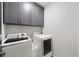 Functional laundry room featuring a washer and dryer for added convenience at 94 Hogue Ne St, Atlanta, GA 30312