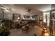 Inviting open-concept living room with a modern ceiling fan and an adjacent kitchen area at 94 Hogue Ne St, Atlanta, GA 30312