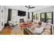 Cozy living room with fireplace, large windows, and stylish decor at 94 Hogue Ne St, Atlanta, GA 30312