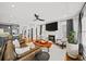 Open concept living space with fireplace, hardwood floors and comfortable seating at 94 Hogue Ne St, Atlanta, GA 30312