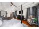 Serene main bedroom showcases a tray ceiling, hardwood floors, and stylish furnishings for a relaxing retreat at 94 Hogue Ne St, Atlanta, GA 30312