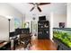 Office with a large screen monitor, ceiling fan and built-in shelving at 94 Hogue Ne St, Atlanta, GA 30312