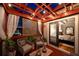 Cozy patio features lattice detail, lights, and seating, with glass doors opening to the home's bedroom at 94 Hogue Ne St, Atlanta, GA 30312