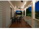 Spacious covered porch with wood flooring, ceiling fan, and outdoor seating offers a relaxing outdoor space at 94 Hogue Ne St, Atlanta, GA 30312