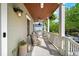 Relaxing covered porch with comfortable seating and a charming wood ceiling at 94 Hogue Ne St, Atlanta, GA 30312