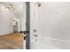 Bathroom features a tub, shower, and a view into a bedroom with closet at 1026 Reeder Cir, Atlanta, GA 30306