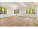 Bright bedroom with hardwood floors, trey ceilings, recessed lights, large windows and natural light at 1026 Reeder Cir, Atlanta, GA 30306