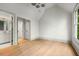 Bright bedroom boasts an ensuite bath, hardwood floors, and modern lighting at 1026 Reeder Cir, Atlanta, GA 30306