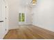 A bedroom is bright and airy, with hardwood floors, natural light and high ceilings at 1026 Reeder Cir, Atlanta, GA 30306